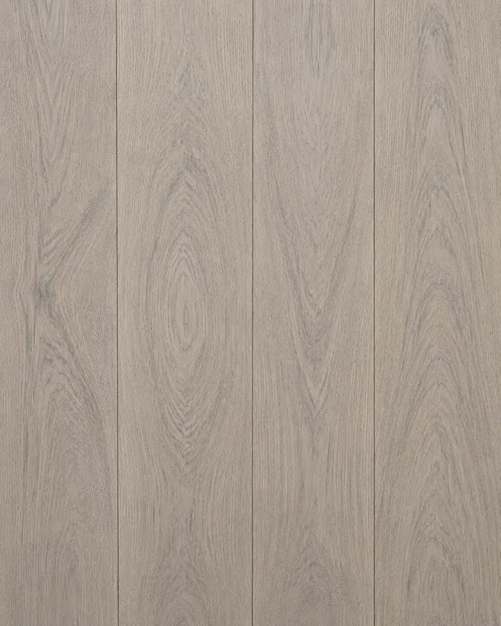 Four planks of pale greige KOVA flooring, their grain flowing continuously across the boards